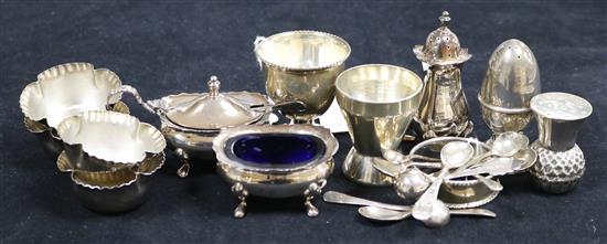 A collection of silver condiments, including four shaped fluted salts and spoons, total 10.4oz approx